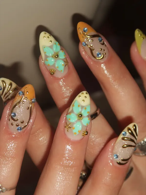 3D pastel florals with gold chrome by Nailed By Yvonne